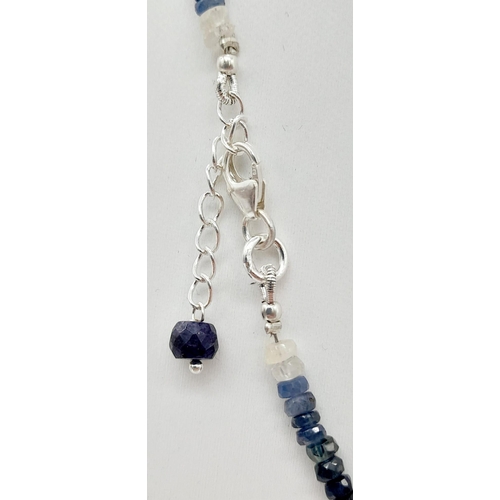 564 - A 120ct (total) Blue Ceylon Sapphire Necklace - 40cm, silver clasp, with a pair of sapphire drop ear... 