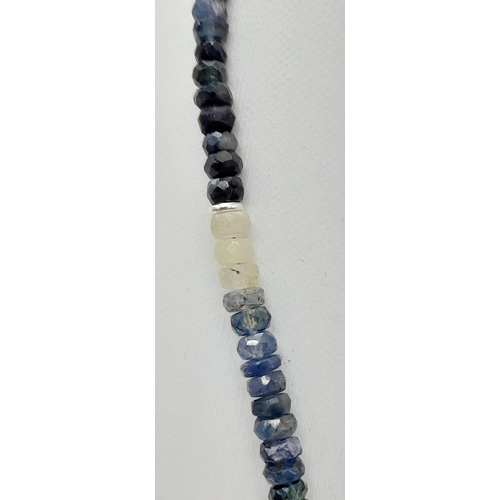 564 - A 120ct (total) Blue Ceylon Sapphire Necklace - 40cm, silver clasp, with a pair of sapphire drop ear... 