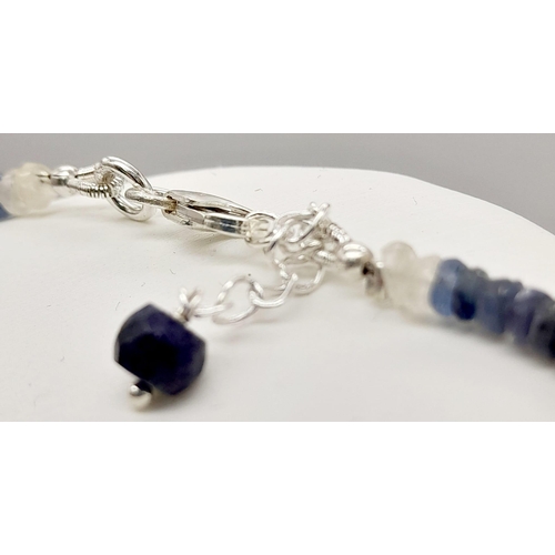 564 - A 120ct (total) Blue Ceylon Sapphire Necklace - 40cm, silver clasp, with a pair of sapphire drop ear... 