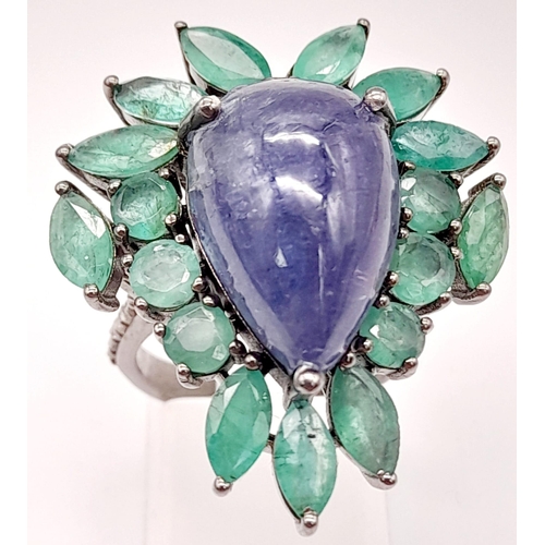 58 - A 13ct Tanzanite Cabochon Gemstone Ring with 8ct of Emerald Leaves and 0.30ct of Diamond Accents on ... 