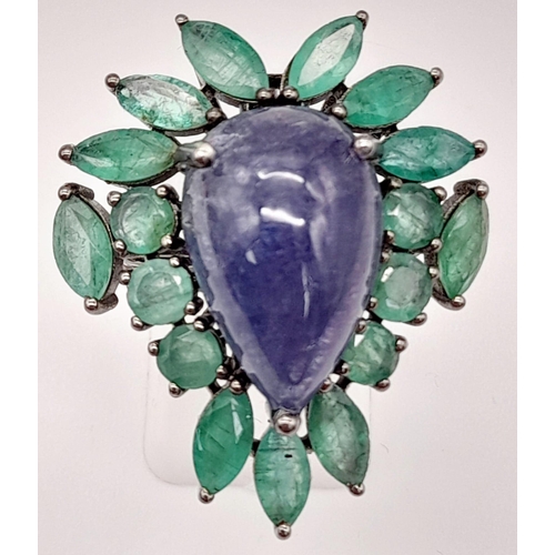 58 - A 13ct Tanzanite Cabochon Gemstone Ring with 8ct of Emerald Leaves and 0.30ct of Diamond Accents on ... 