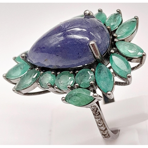 58 - A 13ct Tanzanite Cabochon Gemstone Ring with 8ct of Emerald Leaves and 0.30ct of Diamond Accents on ... 