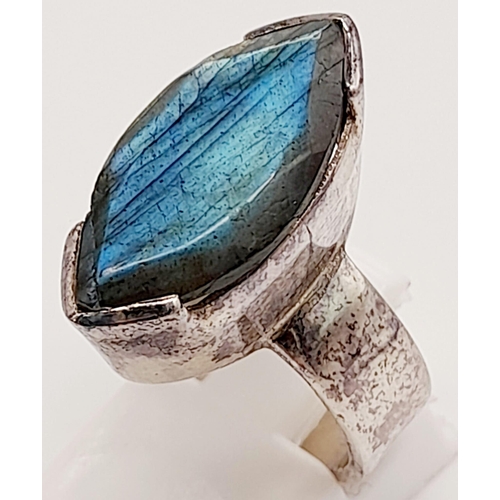 757 - Four 925 Silver Jewellery Items: Crossover opal ring - size R, blue-stone ring - size N, a crazed ag... 