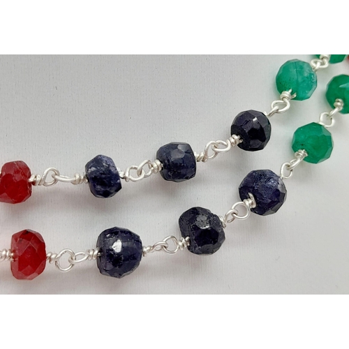 820 - An Emerald, Ruby and Sapphire Necklace with a Pair of Matching Drop Earrings. Necklace - 56cm. Drop ... 