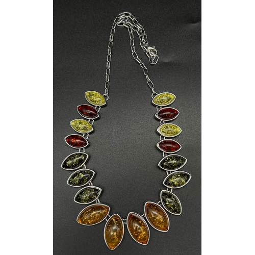 175 - A very attractive, multi-colour, amber necklace, earrings and ring set in a presentation case. Neckl... 