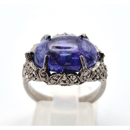 30 - An Art Deco Style 7.30ct Tanzanite Gemstone Ring with 0.65ct Diamond Accents. Set in 925 Silver. Siz... 