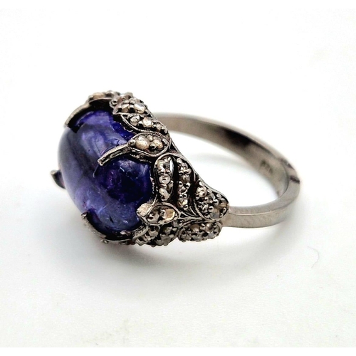 30 - An Art Deco Style 7.30ct Tanzanite Gemstone Ring with 0.65ct Diamond Accents. Set in 925 Silver. Siz... 