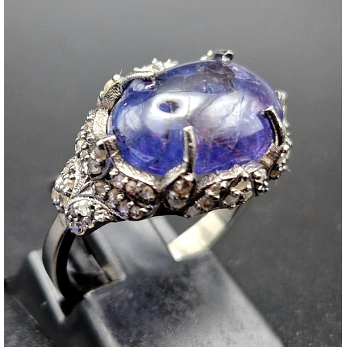 30 - An Art Deco Style 7.30ct Tanzanite Gemstone Ring with 0.65ct Diamond Accents. Set in 925 Silver. Siz... 