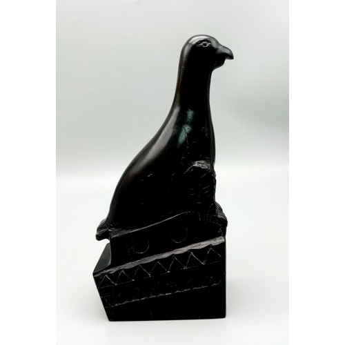 569 - An Ebony Wood Sculpture from the Classic Gibbs Collection.
21cm tall