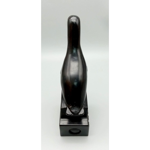 569 - An Ebony Wood Sculpture from the Classic Gibbs Collection.
21cm tall