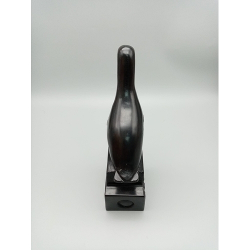 569 - An Ebony Wood Sculpture from the Classic Gibbs Collection.
21cm tall