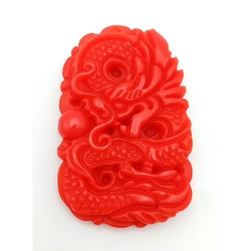 1185 - A Red Jade Chinese Dragon Pendant. 5cm