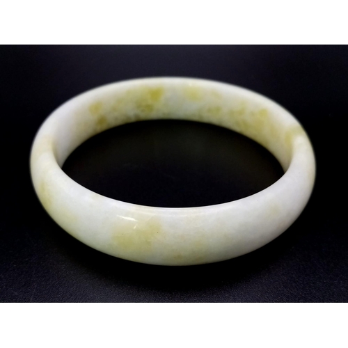 490 - A High Quality Chinese Cauliflower Jade Bangle. 65mm inner diameter. 17mm width.