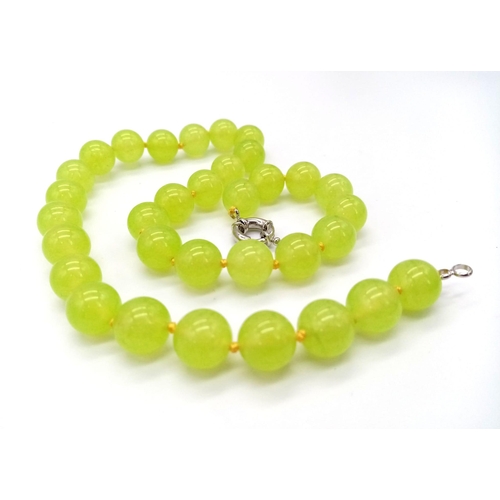 514 - A Vibrant Apple-Green Peridot Beaded Necklace. 44cm length. 12mm beads.