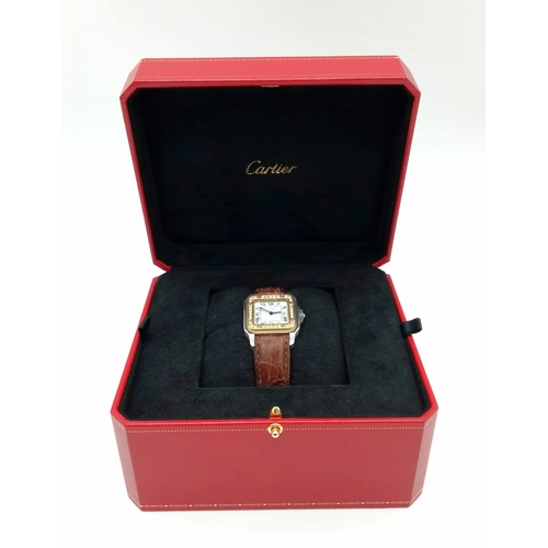 280 - A LADIES CARTIER SANTOS AUTOMATIC TANK WATCH WITH DIAMOND AND GOLD BEZEL, ORIGINAL CARTIER STRAP AND... 