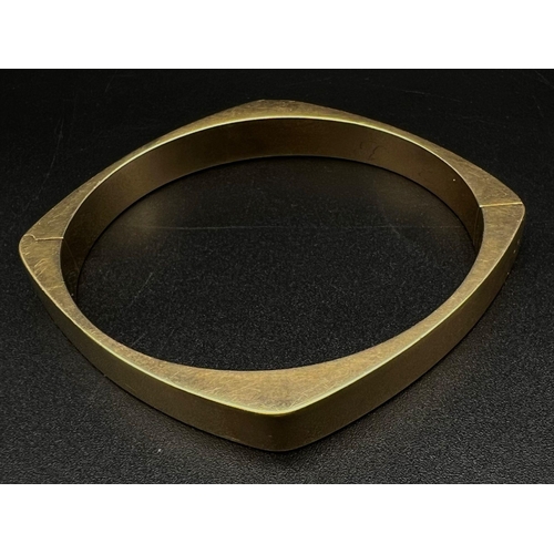 22 - A Hans Hansen 14k Yellow Gold Bangle. Lovely piece from this Danish designer. Clip opening. 24.9g. 6... 