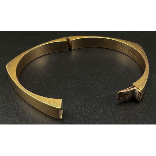 22 - A Hans Hansen 14k Yellow Gold Bangle. Lovely piece from this Danish designer. Clip opening. 24.9g. 6... 