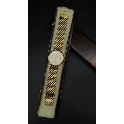 294 - A 9K GOLD CITIZEN GENTS WRIST WATCH ON SOLID GOLD STRAP. 34mm  QUARTZ MOVEMENT.