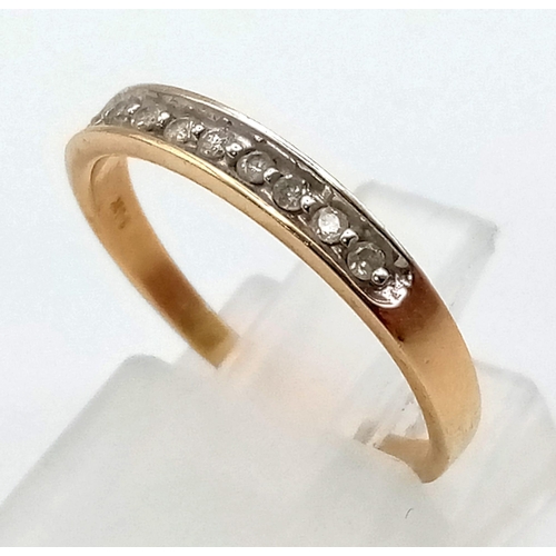 579 - A 14K Yellow Gold Diamond Half-Eternity Ring. Size L. 1.52g total weight.