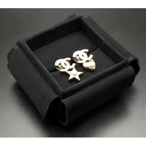 839 - A Pair of Original Chanel Star and Heart Fashion Earrings. Comes in original Chanel packaging. Ref: ... 