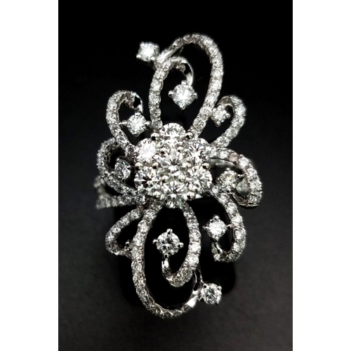 122 - An 18K White Gold Floral Burst Diamond Ring. This 2ct bright-white diamond ring is in as new conditi... 