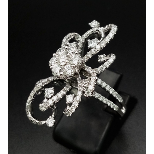 122 - An 18K White Gold Floral Burst Diamond Ring. This 2ct bright-white diamond ring is in as new conditi... 