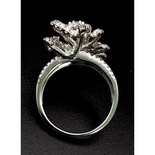 122 - An 18K White Gold Floral Burst Diamond Ring. This 2ct bright-white diamond ring is in as new conditi... 