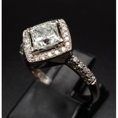 325 - An 18K White Gold Princess Cut Diamond Ring. Sublime 1ct central clean, white diamond with a diamond... 