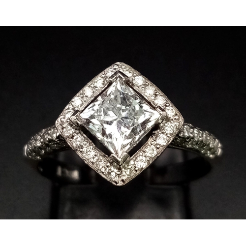 325 - An 18K White Gold Princess Cut Diamond Ring. Sublime 1ct central clean, white diamond with a diamond... 