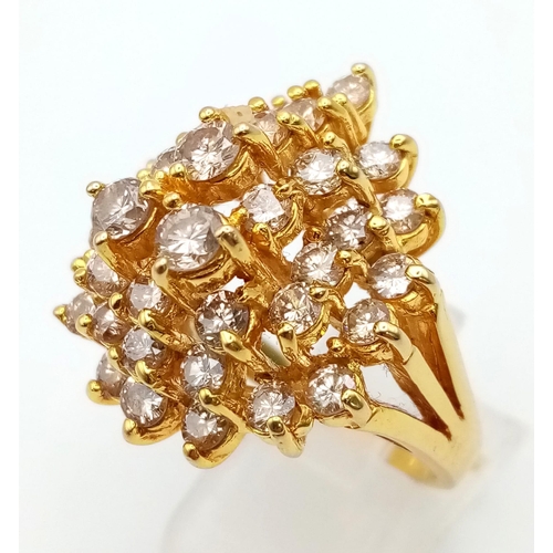 341 - A 14K Yellow Gold Floral Burst Diamond Ring. 34 VVS/VS brilliant round-cut diamonds equate to a mass... 