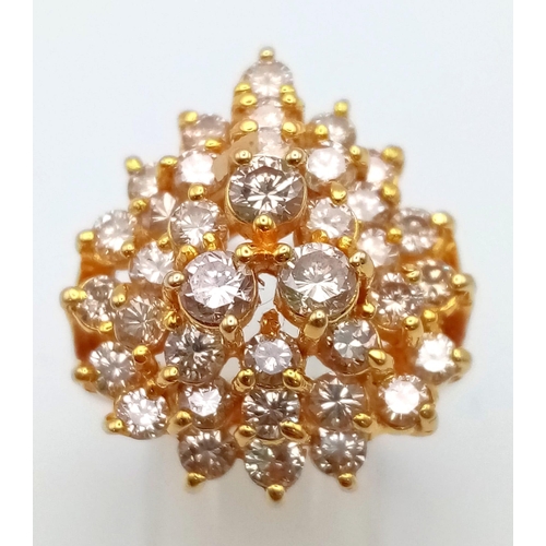 341 - A 14K Yellow Gold Floral Burst Diamond Ring. 34 VVS/VS brilliant round-cut diamonds equate to a mass... 