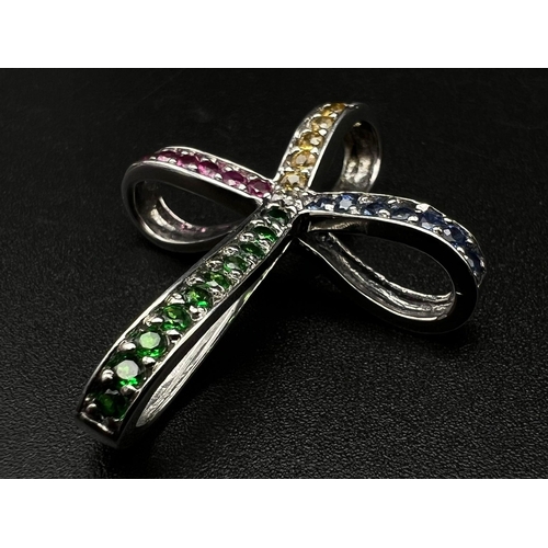 388 - A 14K White Gold Multi-Gemstone Bow-Cross Pendant. 3 x 4cm. 6.11g total weight. Ref: 42