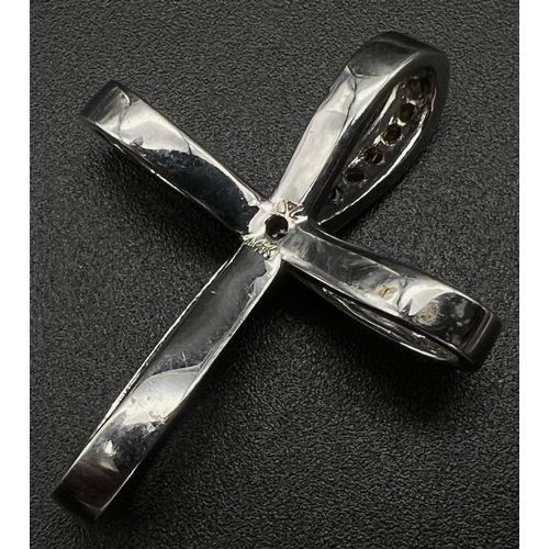 388 - A 14K White Gold Multi-Gemstone Bow-Cross Pendant. 3 x 4cm. 6.11g total weight. Ref: 42