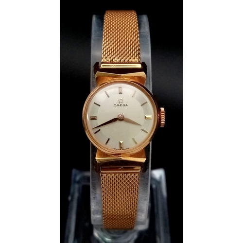 40 - A Wonderful Vintage 18K Gold Ladies Omega Watch. 18K gold bracelet and case - 14mm. White dial. Mech... 