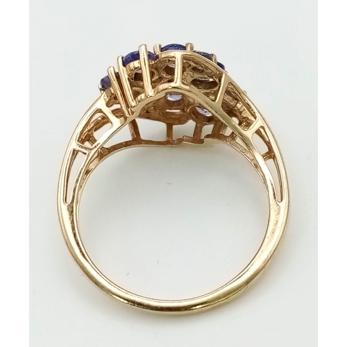 739 - A 9K Yellow Gold and Tanzanite Decorative Floral Ring. Size O. 3g total weight. Ref: 24