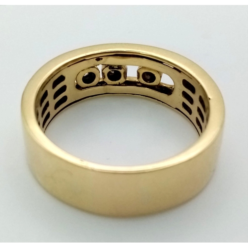 150 - An 18K Yellow Gold Floating Three Diamond Band Ring. Size T. 9.4g total weight. Ref: 52