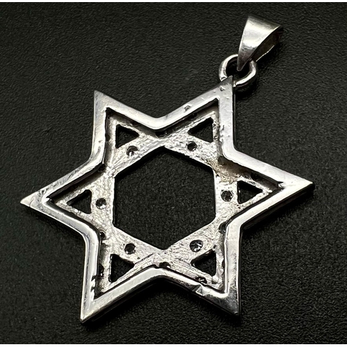 639 - An 18K White Gold and Diamond Star of David Pendant. 4cm. 4.23g. Ref:87