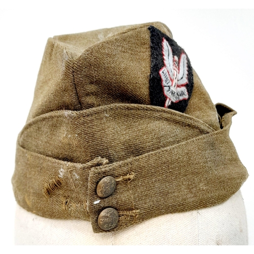 324 - WW2 British Army “Chip Bag” side cap with a cloth S.A.S cap badge.