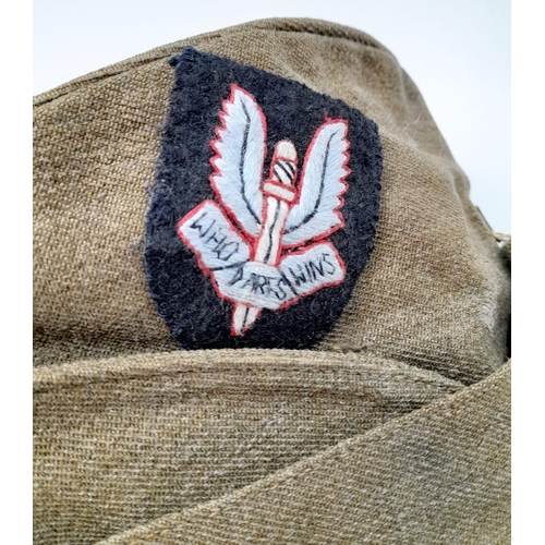 324 - WW2 British Army “Chip Bag” side cap with a cloth S.A.S cap badge.