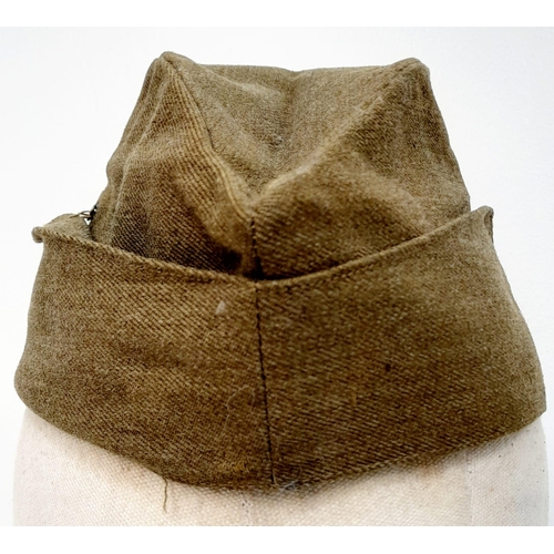 324 - WW2 British Army “Chip Bag” side cap with a cloth S.A.S cap badge.