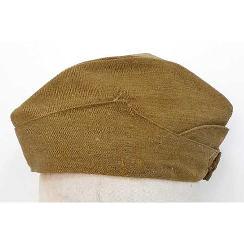 324 - WW2 British Army “Chip Bag” side cap with a cloth S.A.S cap badge.