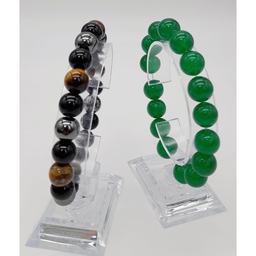 1123 - A Green Jade and a Tigers Eye, Obsidian and Hematite Expandable Bracelet. Jade -12mm. Others - 8mm.