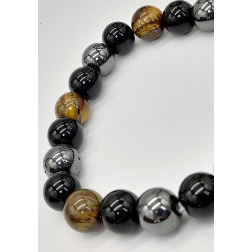 1123 - A Green Jade and a Tigers Eye, Obsidian and Hematite Expandable Bracelet. Jade -12mm. Others - 8mm.