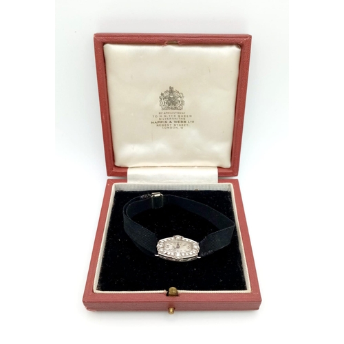 32 - An Antique Mappin and Webb (By Royal Appointment) Platinum and Diamond Bezel Ladies Watch. Mechanica... 