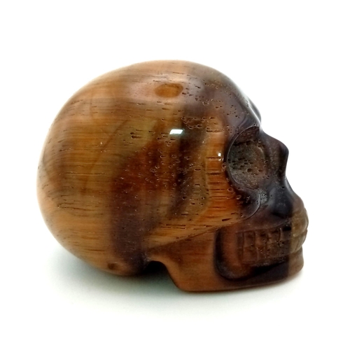 576 - A Hand-Carved Tigers Eye Skull Figure. Ornament or paperweight. 6cm