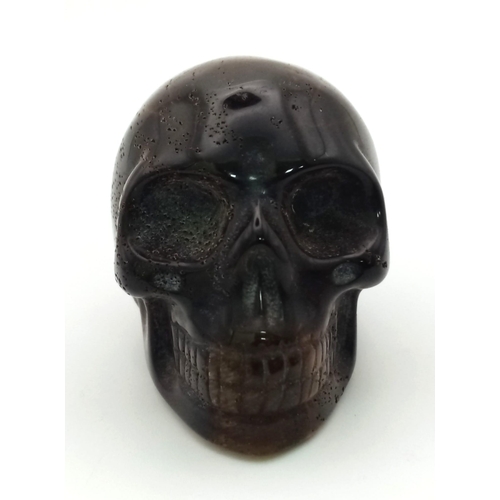 576 - A Hand-Carved Tigers Eye Skull Figure. Ornament or paperweight. 6cm