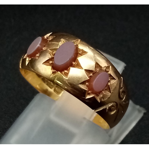 577 - A 15K Gold Matrix Carnelian Three Stone Band Ring. Hallmarks for Chester. Size N. 3.57g total weight... 