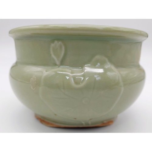 590 - A RARE ANTIQUE CHINESE BUDDHIST CELADON CENSOR WITH EXCEPTIONAL LOTUS FLOWER AND LEAF DESIGN . CIRCA... 