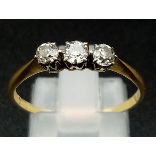 749 - An 18K Yellow Diamond Trilogy Ring. Three round-cut diamonds set in platinum. Size P. 1.62g total we... 