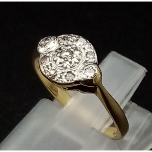 756 - An 18K Edwardian Yellow Gold, Platinum and Diamond Ring. Nine diamonds. Size G. 2.28g total weight.